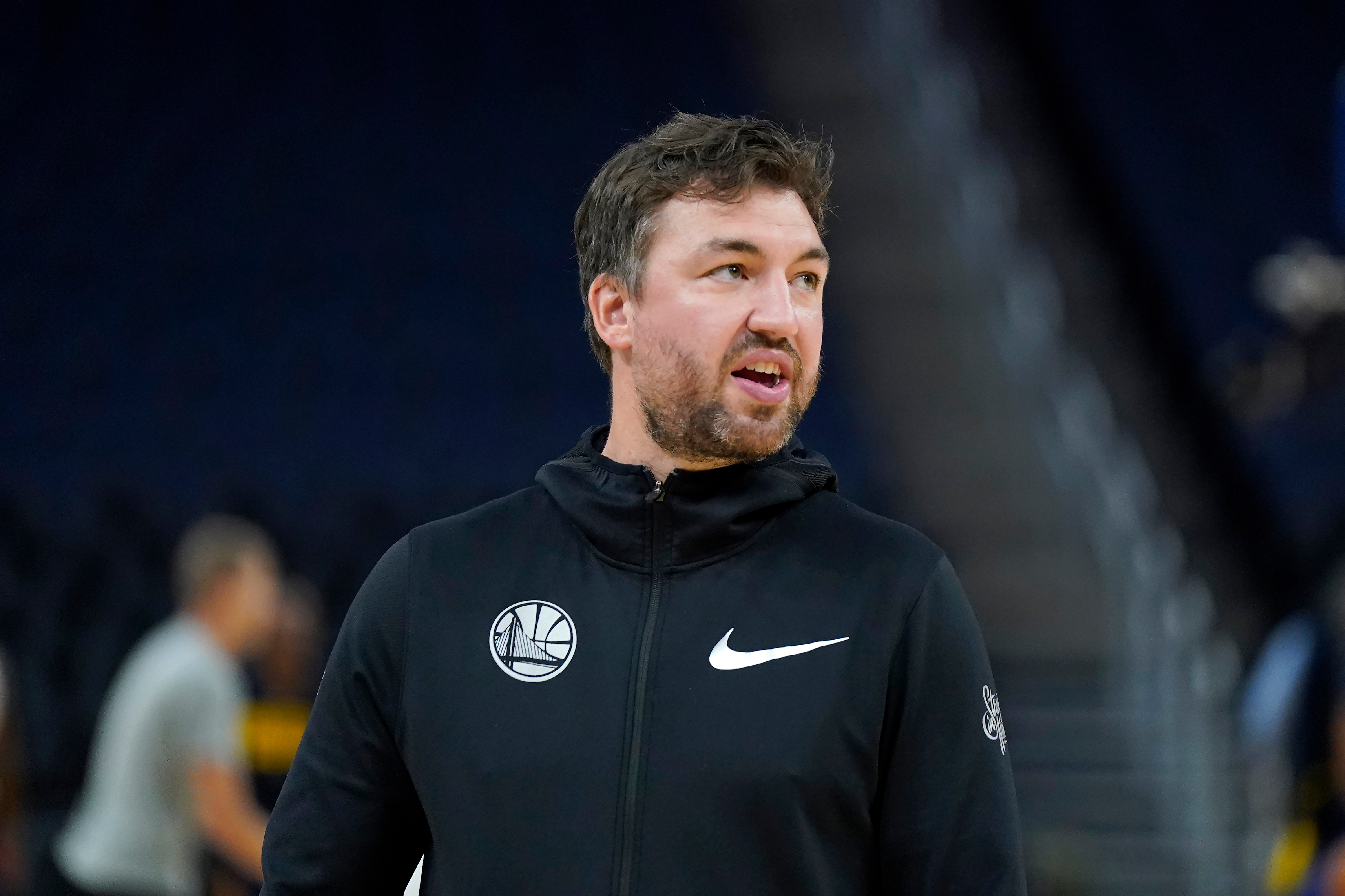 FILE - Golden State Warriors assistant coach Chris DeMarco stands before an NBA preseason basketball game against the Denver Nuggets in San Francisco, Oct. 14, 2022. 