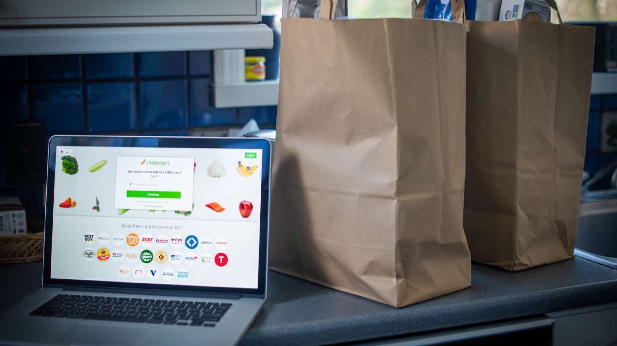 The Instacart website on a laptop computer. Online grocery delivery service Instacart used AI to charge different prices for the same item, up to 20% more for different shoppers, a new report says.