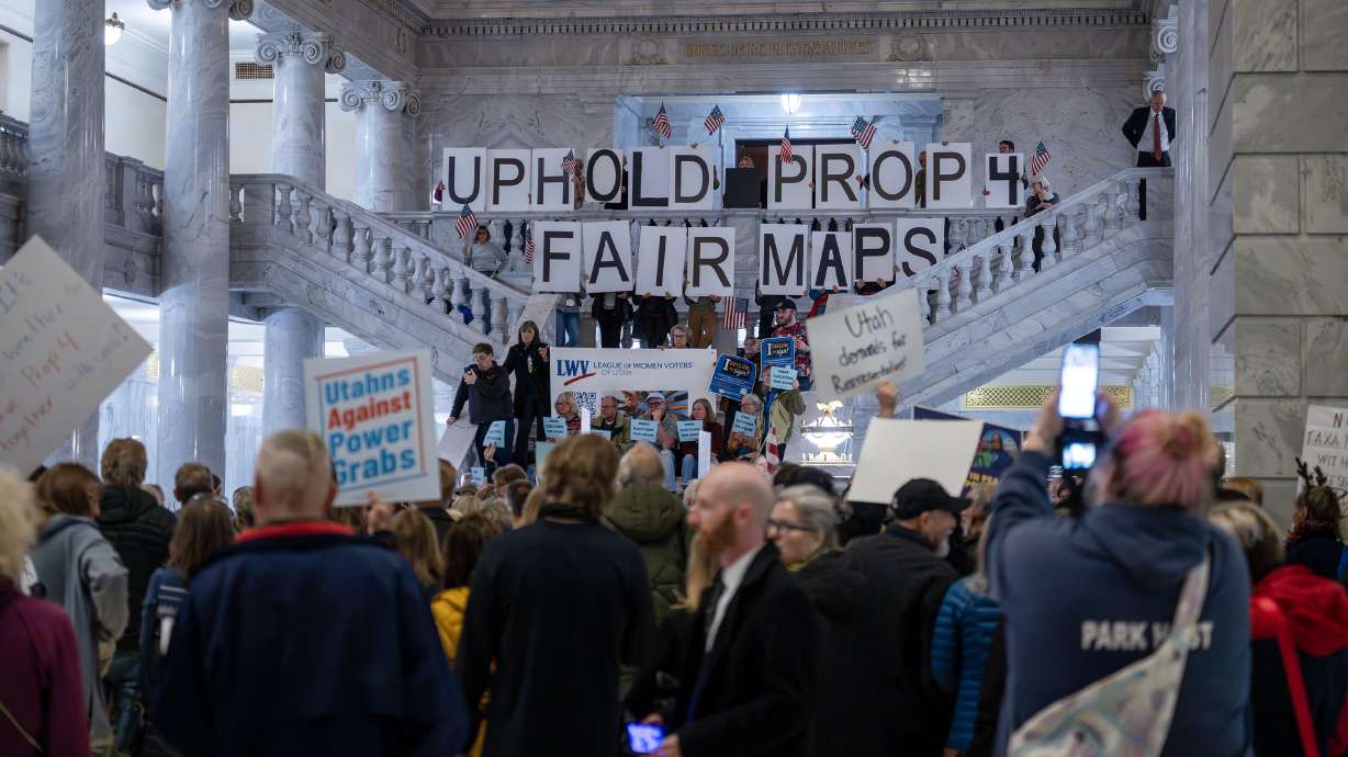 The League of Women Voters holds a rally at the state Capitol in Salt Lake City on Tuesday. As lawmakers spar with judges over redistricting, here's what voters and the Constitution say about who has the power to draw congressional maps.