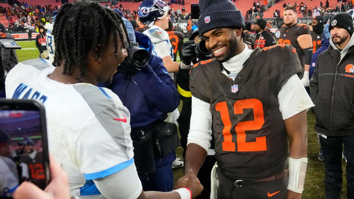Tennessee Titans quarterback Cam Ward, left, and Cleveland Browns quarterback Shedeur Sanders (12) greet each other after an NFL football game in Cleveland, Sunday, Dec. 7, 2025.