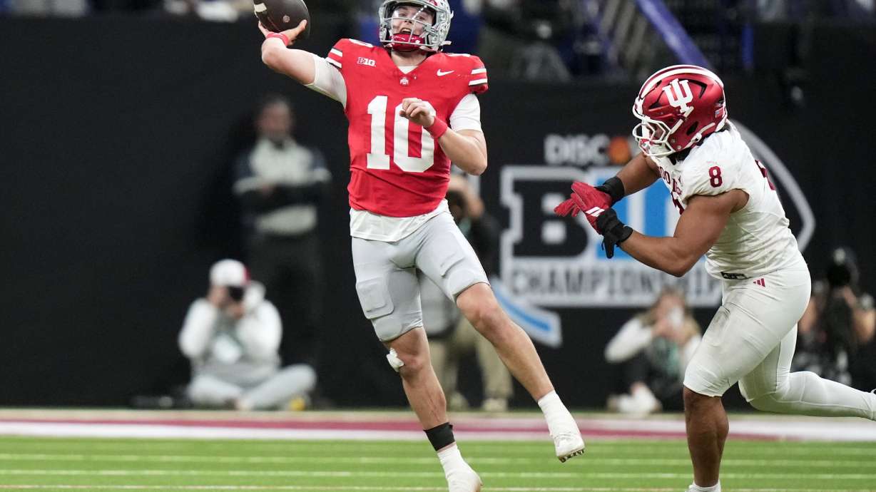 Ohio State's Julian Sayin throws against Indiana's Stephen Daley during the second half of the Big Ten championship NCAA college football game in Indianapolis, Saturday, Dec. 6, 2025.