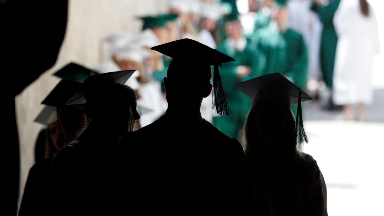 Payson High School's class of 2004 line up for commencement ceremonies at the Marriott Center in Provo on May 25, 2004. A new state education report showed Utah's graduation rate rose, while its dropout rate has been sliced in half.