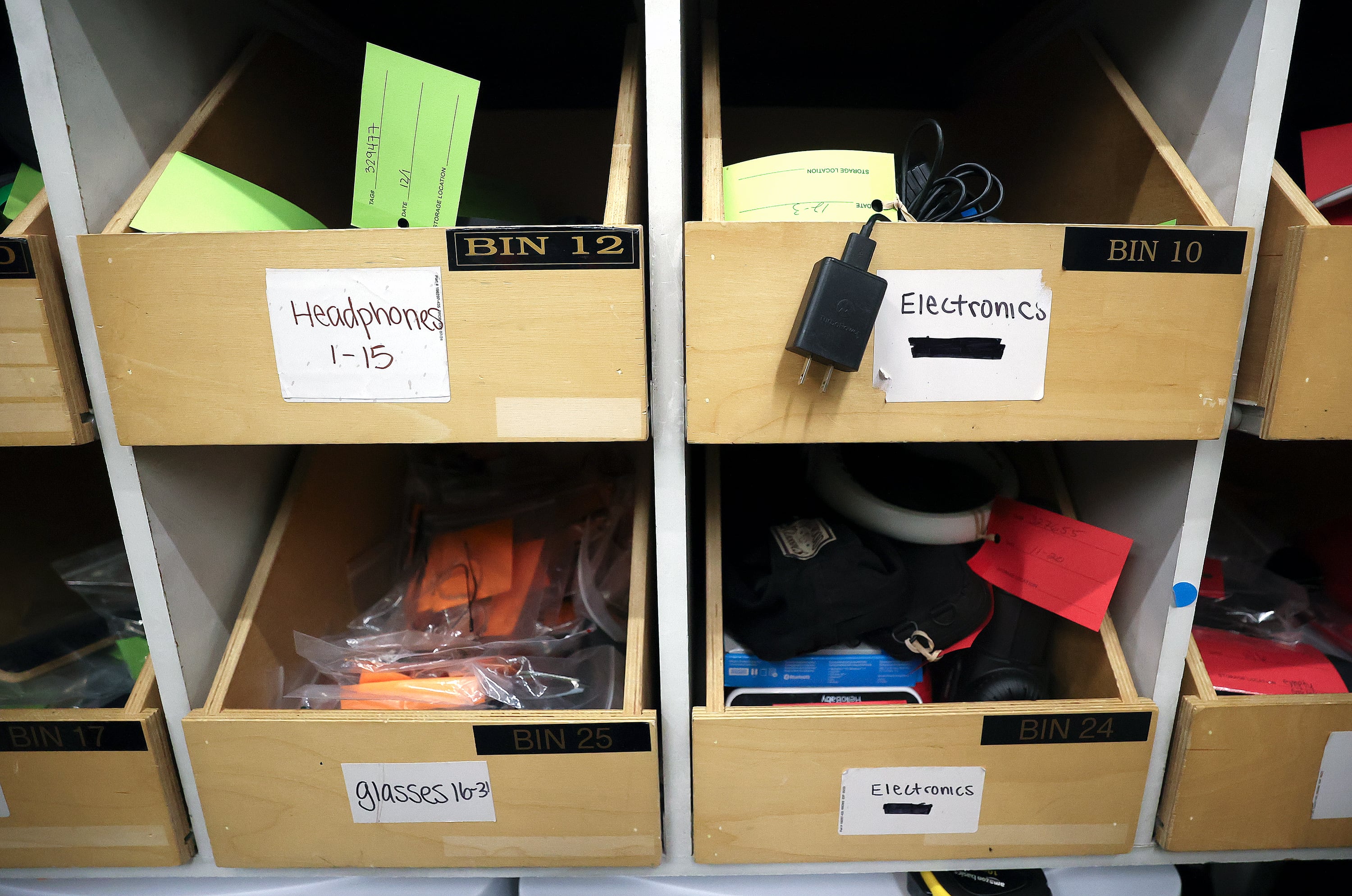 Headphones, glasses and electronics are pictured at the Salt Lake City International Airport lost and found in Salt Lake City on Dec. 4.