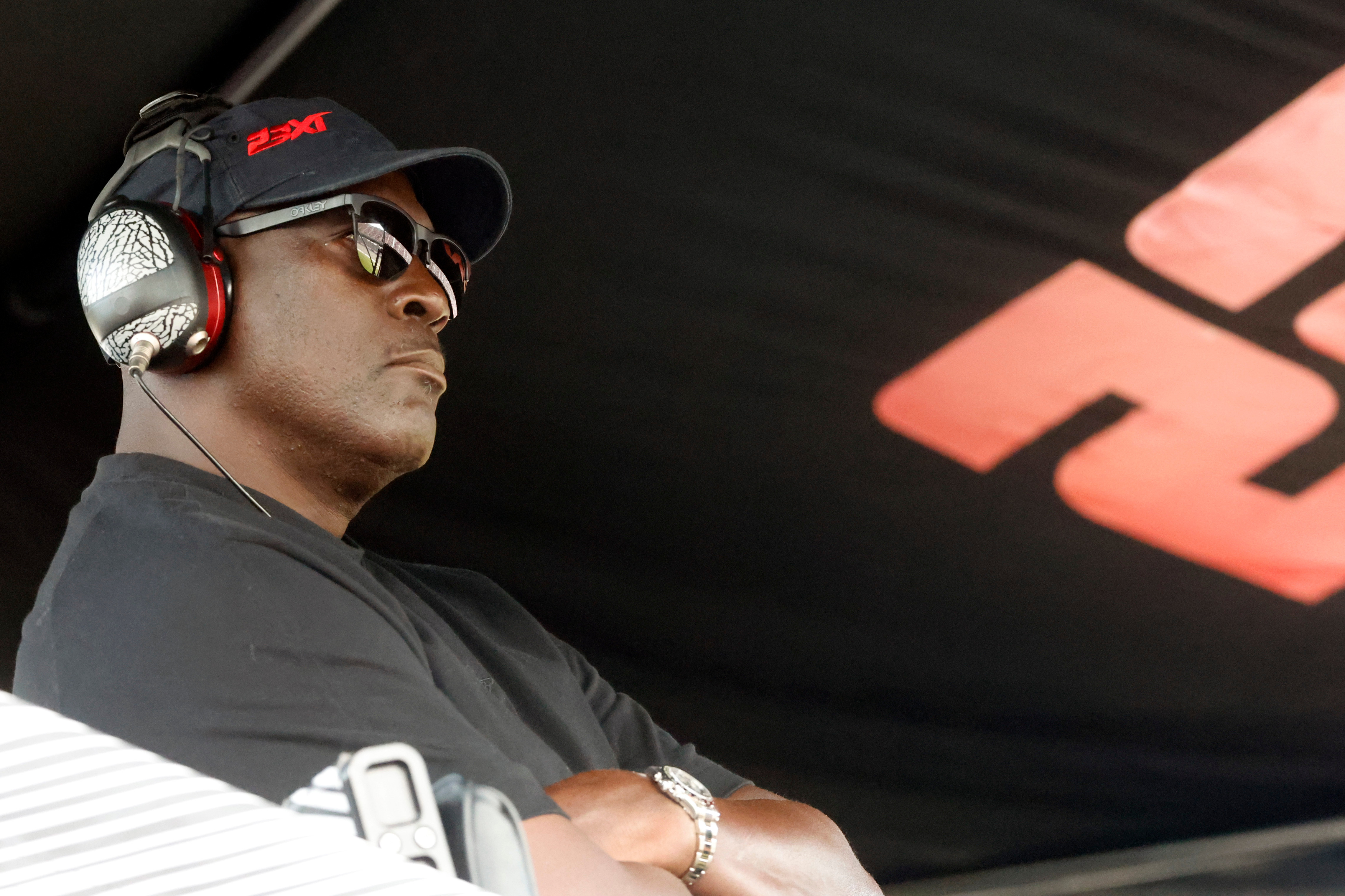 FILE - Michael Jordan, co-owner of 23XI Racing, sits in his pit box during a NASCAR Cup Series auto race at Talladega Superspeedway, Sunday, Oct. 6, 2024, in Talladega, Ala.