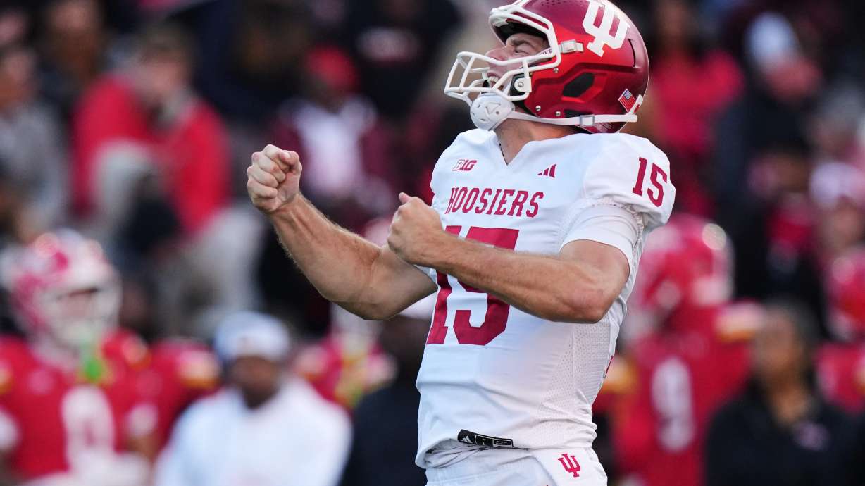 FILE - Indiana quarterback Fernando Mendoza (15) celebrates after throwing a touchdown pass to wide receiver Omar Cooper Jr. during the first half of an NCAA college football game against Maryland, Saturday, Nov. 1, 2025, in College Park, Md.