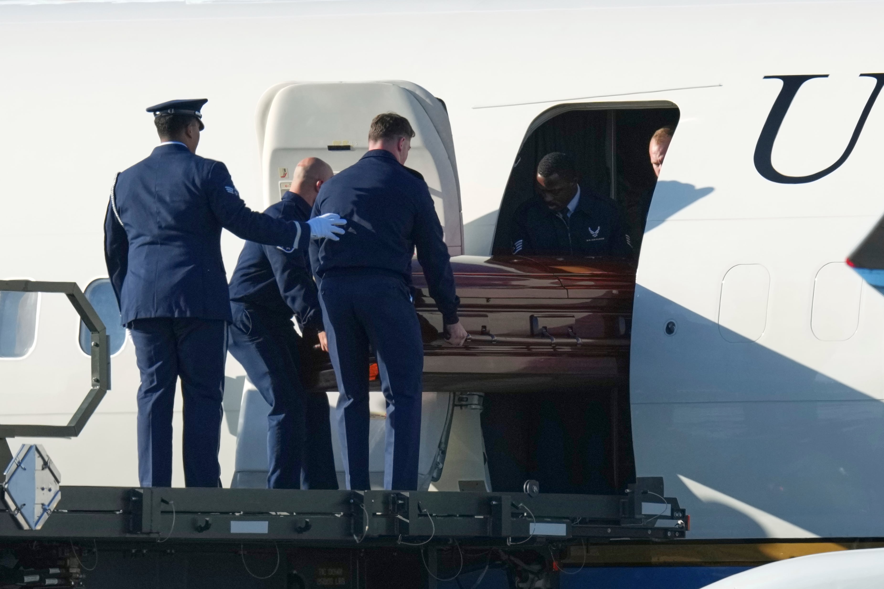 The casket containing the body of conservative activist and Turning Point USA co-founder Charlie Kirk is removed from Air Force Two at Phoenix Sky Harbor International Airport, Sept. 11, in Phoenix, Ariz. Erika Kirk asked for grace for the family as conspiracy theories around her husband's death swirled.