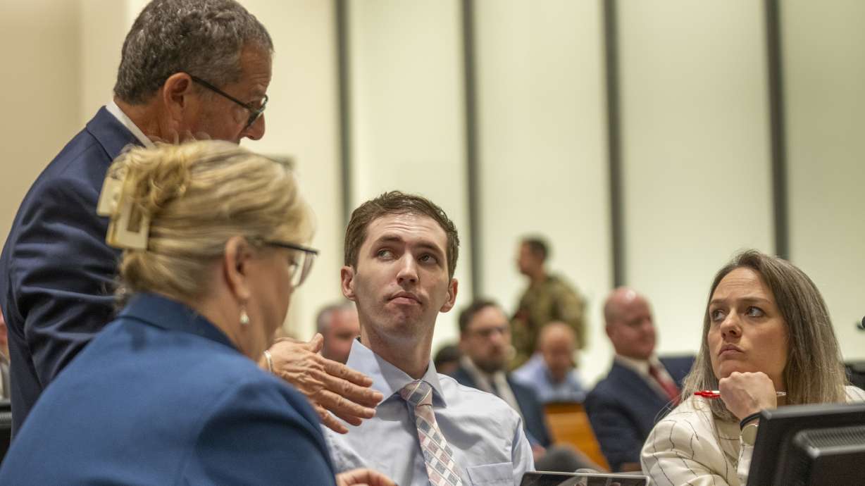 Tyler Robinson talks with his attorneys during a court hearing in Provo on Dec. 11, 2025. Robinson has replied to the media's and prosecutors' opposition to a proposal to be keep cameras out of the courtroom during his capital murder trial.