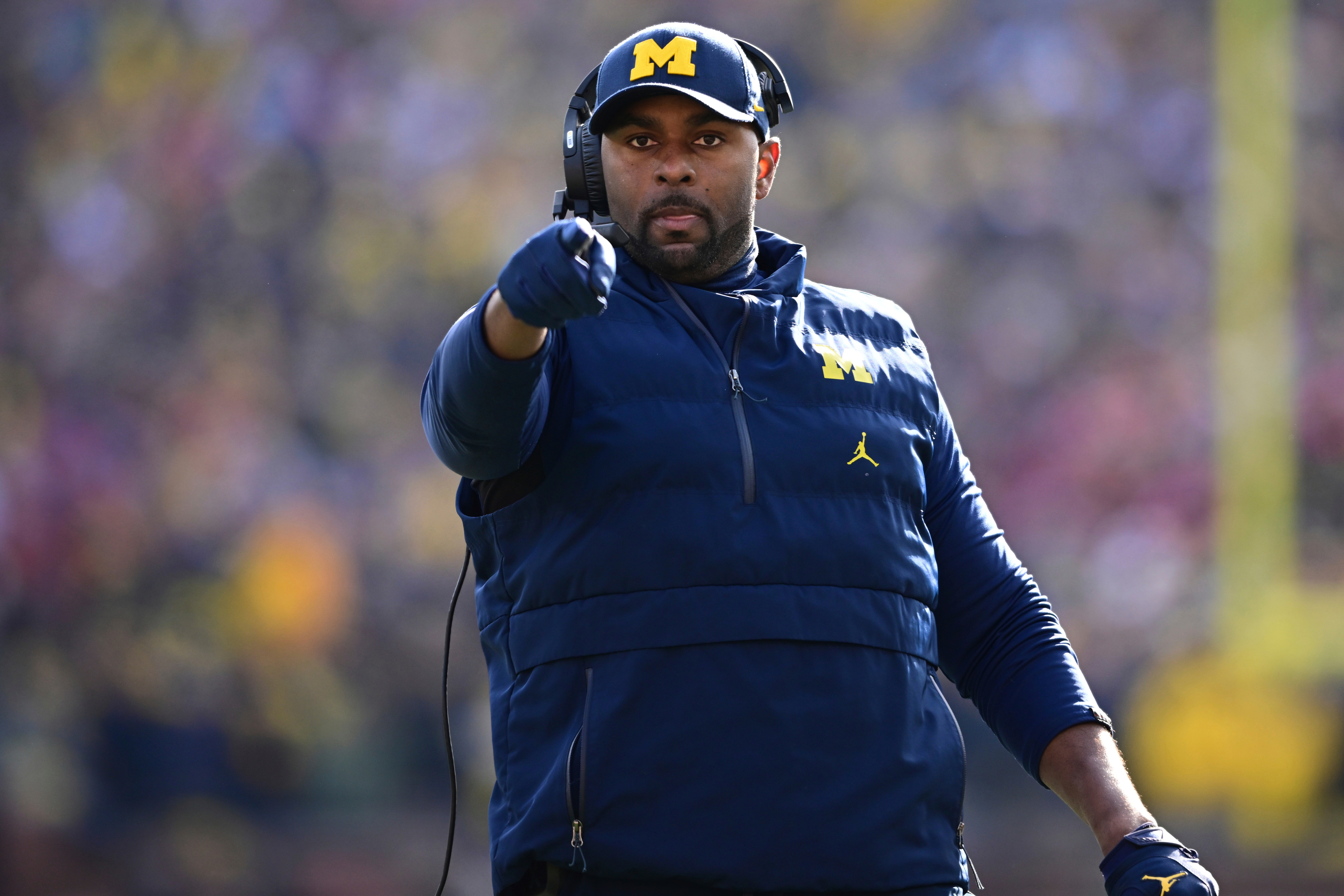 FILE - Michigan acting head coach Sherrone Moore reacts to a video replay during the first half of an NCAA college football game against Ohio State, Saturday, Nov. 25, 2023, in Ann Arbor, Mich. 