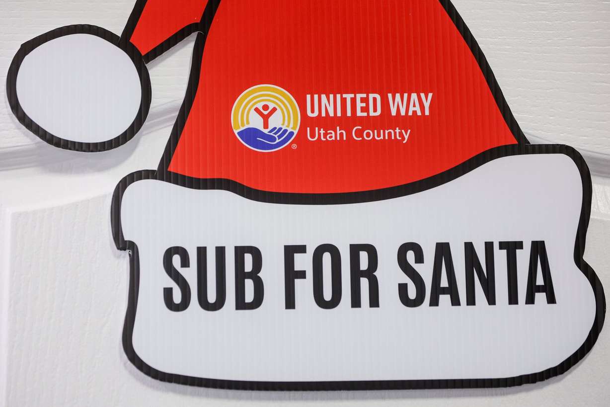 A sign hangs on the door of the Sub for Santa sorting room at United Way Utah County in Provo on Thursday.