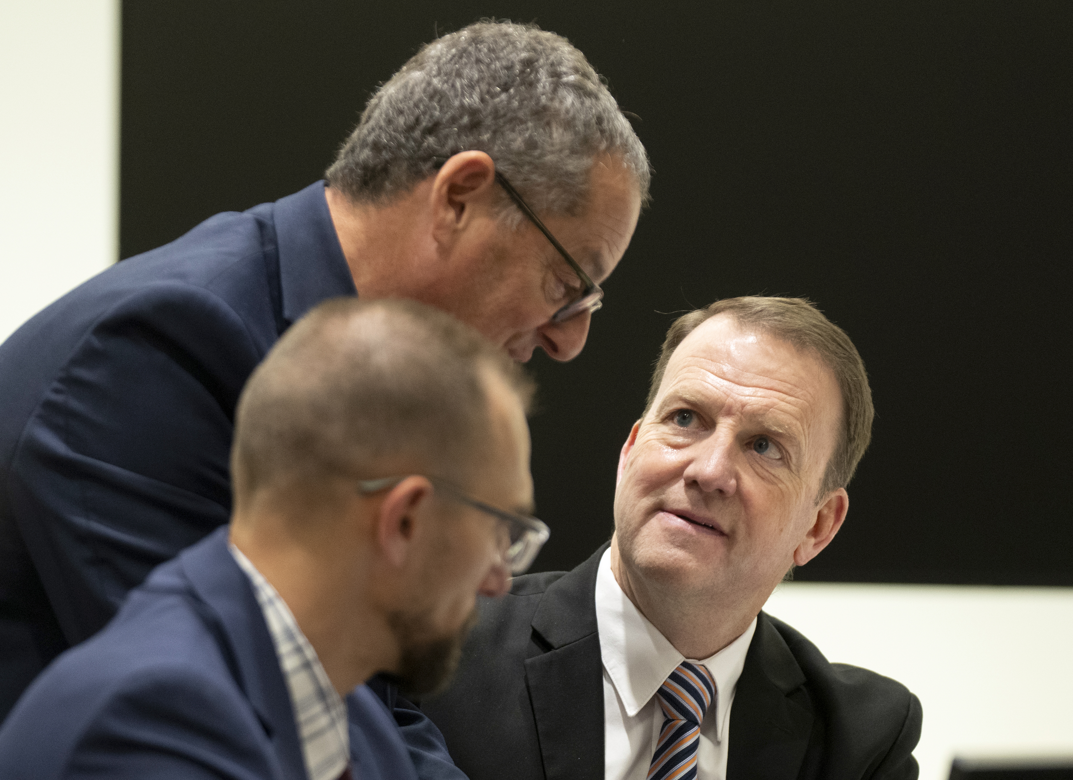 Defense attorney Richard Novak, top, speaks with Utah County Attorney’s Office general counsel Christopher Ballard, right, during a hearing for Tyler Robinson in Provo's 4th District Court on Thursday. Robinson is accused of fatally shooting Charlie Kirk.