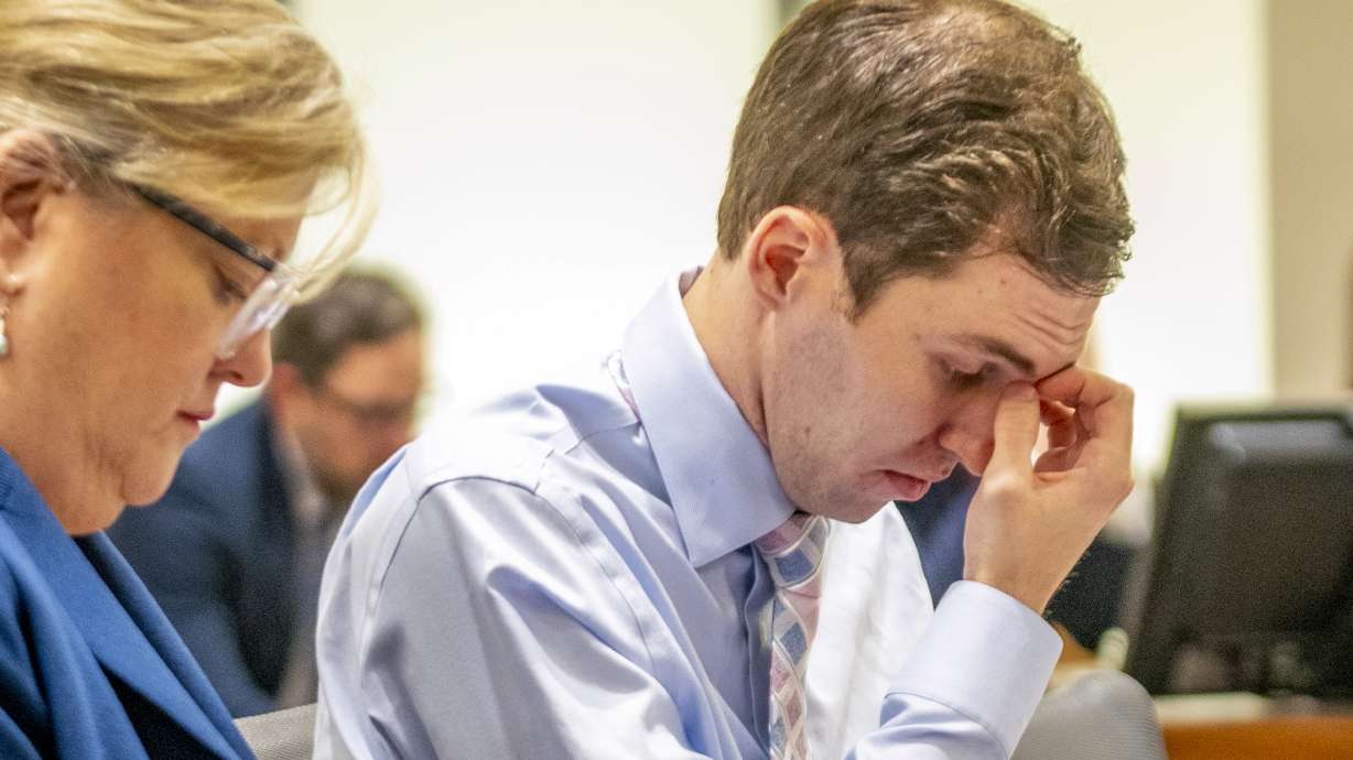 Attorney Kathryn Nester, left, sits next to Tyler Robinson during a hearing in Provo on Dec. 11, 2025. Robinson is charged with killing Charlie Kirk. A hearing is scheduled for Friday to argue whether courtroom cameras should be allowed during his case.