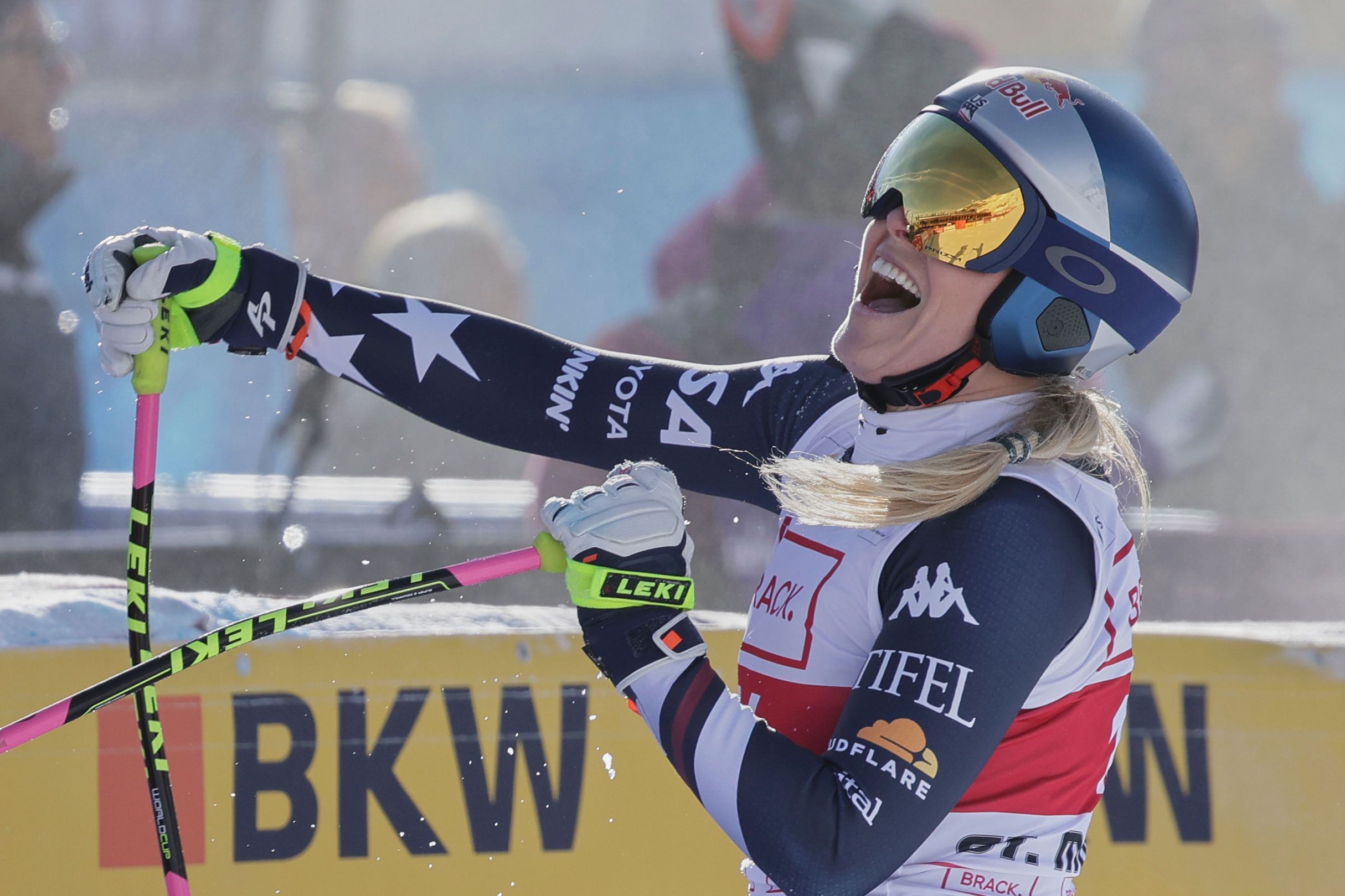 United States' Lindsey Vonn celebrates at the finish area of an alpine ski, women's World Cup downhill in St. Moritz, Switzerland, Friday Dec.12, 2025. 