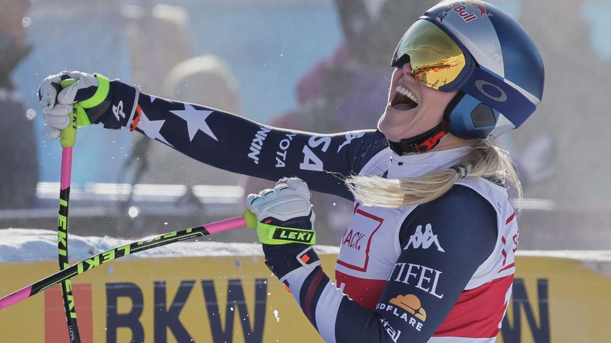 United States' Lindsey Vonn celebrates at the finish area of an alpine ski, women's World Cup downhill in St. Moritz, Switzerland, Friday Dec.12, 2025.