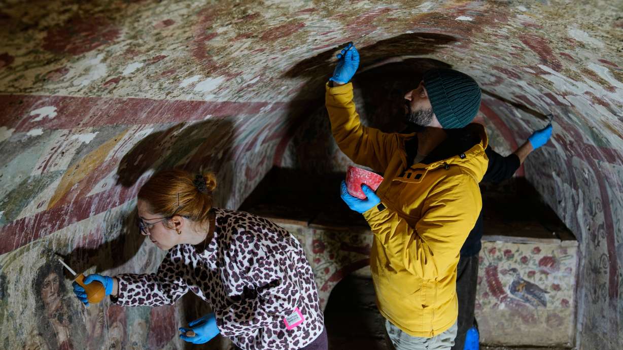 Archaeologists clean and restore frescoes inside a 3rd-century tomb where a rare early Christian depiction of Jesus as the "Good Shepherd" was discovered, in Iznik, Turkey, Friday.