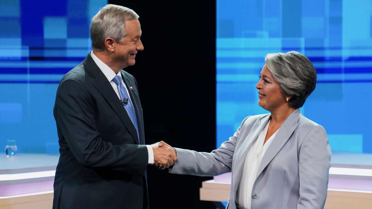 Chileans in Utah will be among those casting ballots in Chile's presidential election on Sunday. The hopefuls, Jose Antonio Kast and Jeannette Jara, shake hands at a presidential debate in Santiago, Chile, on Tuesday.