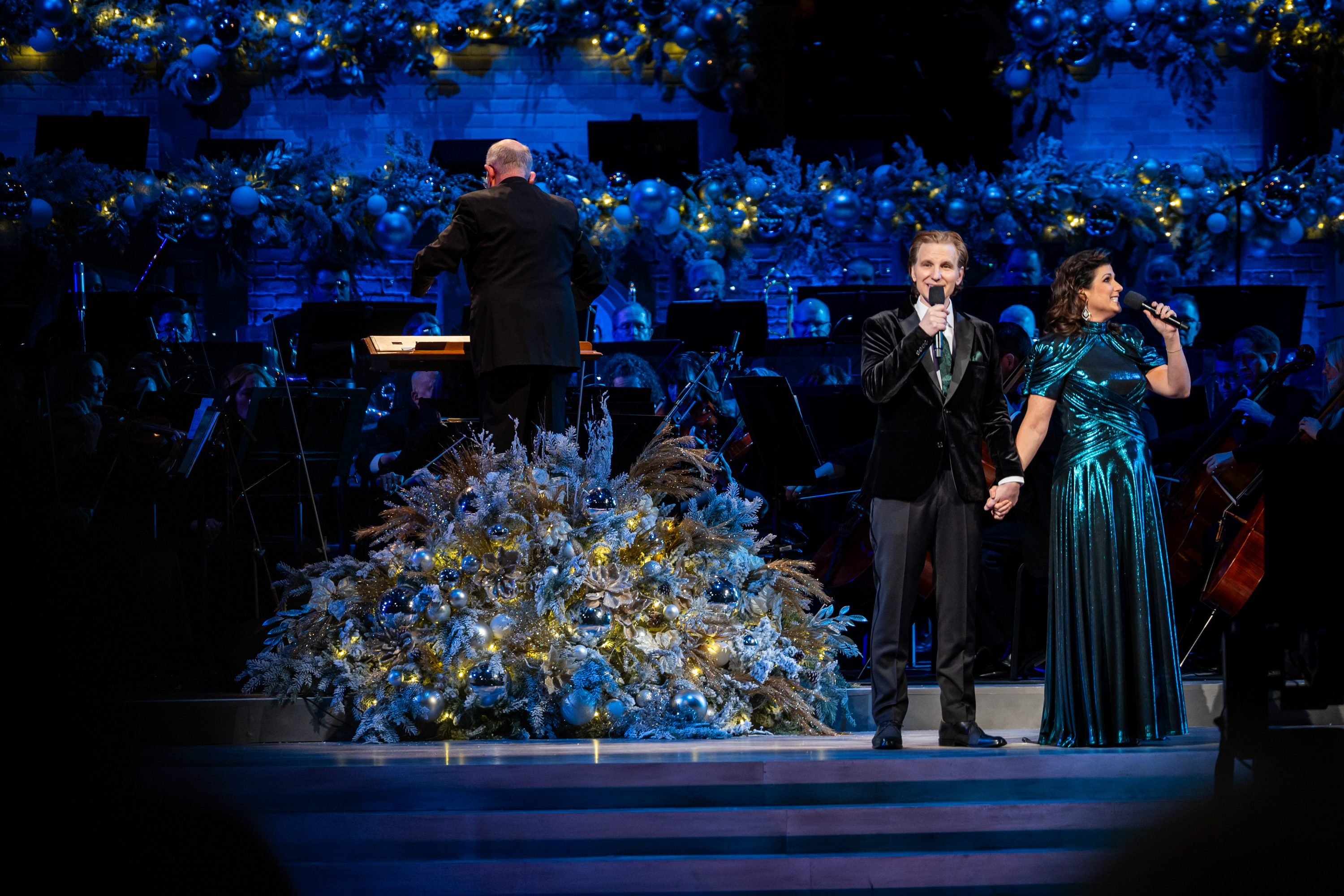 Stephanie J. Block and Sebastian Arcelus perform with The Tabernacle Choir at Temple Square during the Christmas concert at the Conference Center in Salt Lake City on Thursday.