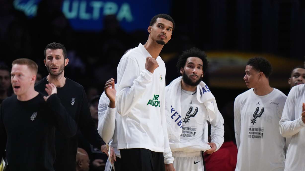 San Antonio Spurs' Victor Wembanyama, center, reacts to a play during the second half of an NBA Cup basketball game against the Los Angeles Lakers Wednesday, Dec. 10, 2025, in Los Angeles.
