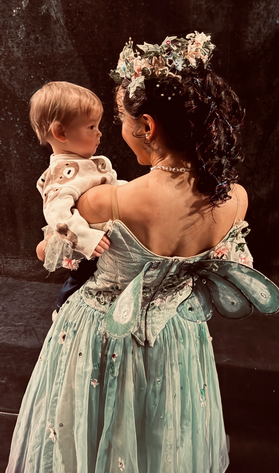Ballet West principal artist Jenna Rae Herrera holds her son Theo after a performance.