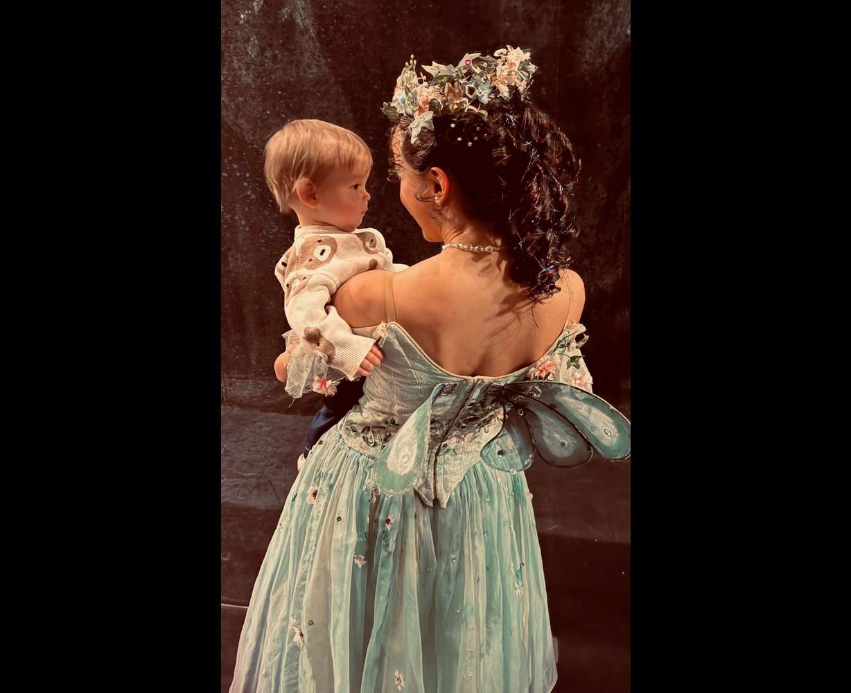 Ballet West principal artist Jenna Rae Herrera holds her son Theo after a performance.