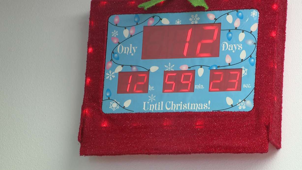 A clock counting down to Christmas is displayed in a Provo warehouse where volunteers sort items for Utah County’s Sub for Santa program, Friday. United Way CEO and President Bill Hulterstrom said there are "amazing pressures" on families this year.