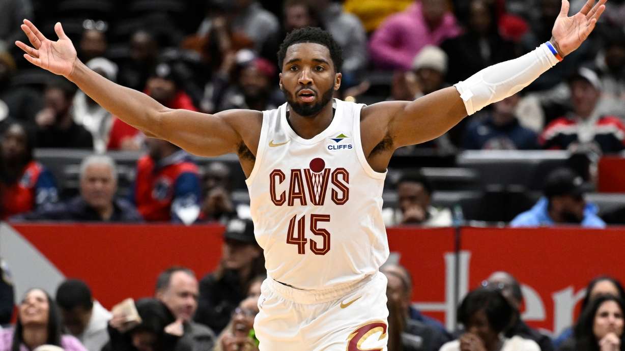 Cleveland Cavaliers guard Donovan Mitchell celebrates after his go-ahead basket late in the second half of an NBA basketball game against the Washington Wizards, Friday, Dec. 12, 2025, in Washington.