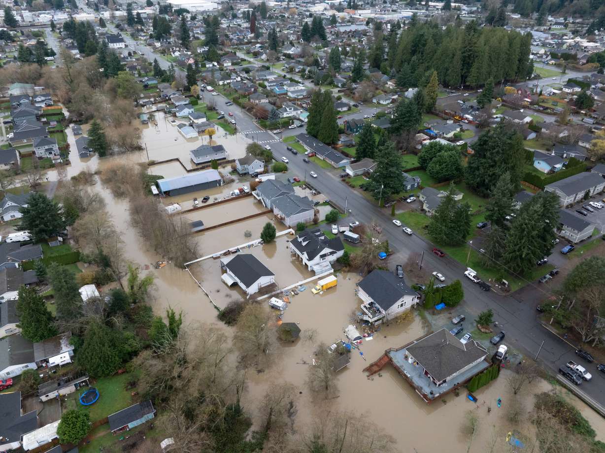 Portions of a neighborhood are flooded on Friday, in Burlington, Wash.