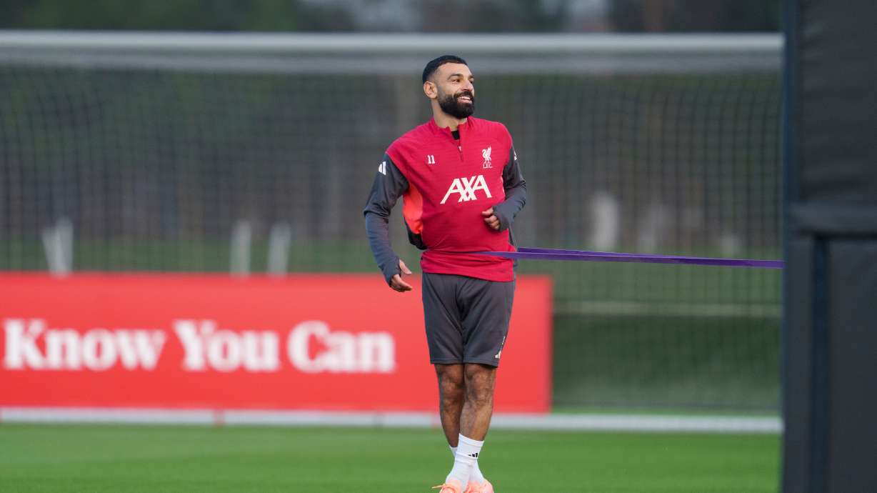 Liverpool's Mohamed Salah smiles as he takes part in a training session in Liverpool, England, Monday, Dec. 8, 2025.