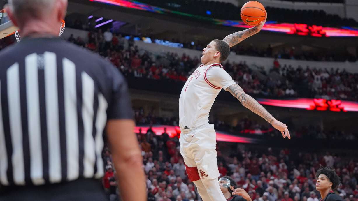 Arkansas forward Trevon Brazile drives in for a dunk during the second half of an NCAA college basketball game against Texas Tech, Saturday, Dec. 13, 2025, in Dallas.