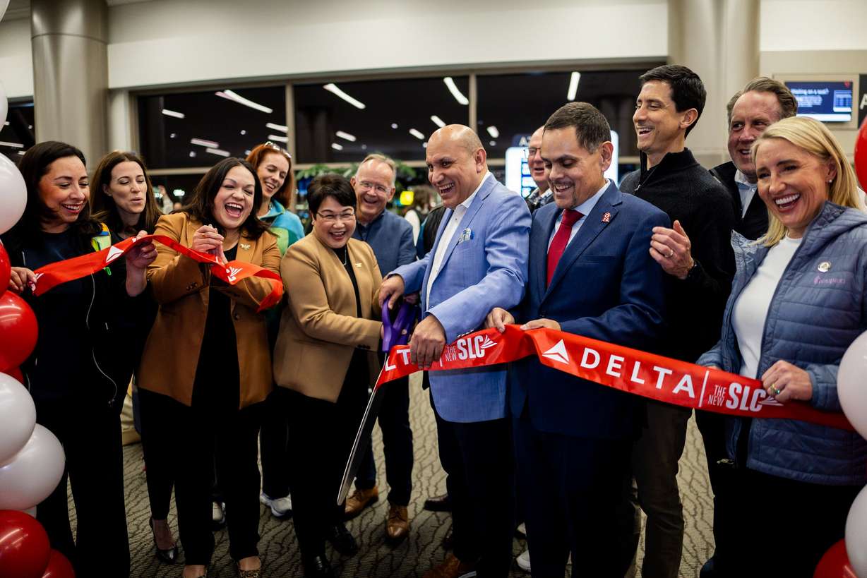 Delegation leaders cut a ribbon before Delta’s maiden flight from Salt Lake City to Lima, Peru, operating daily seasonal service using a Boeing 767-300ER until Jan. 25, 2026, at the Salt Lake City International Airport in Salt Lake City on Dec. 4. Former honorary Consul of Peru David Utrilla said the service will connect the hearts of many people.