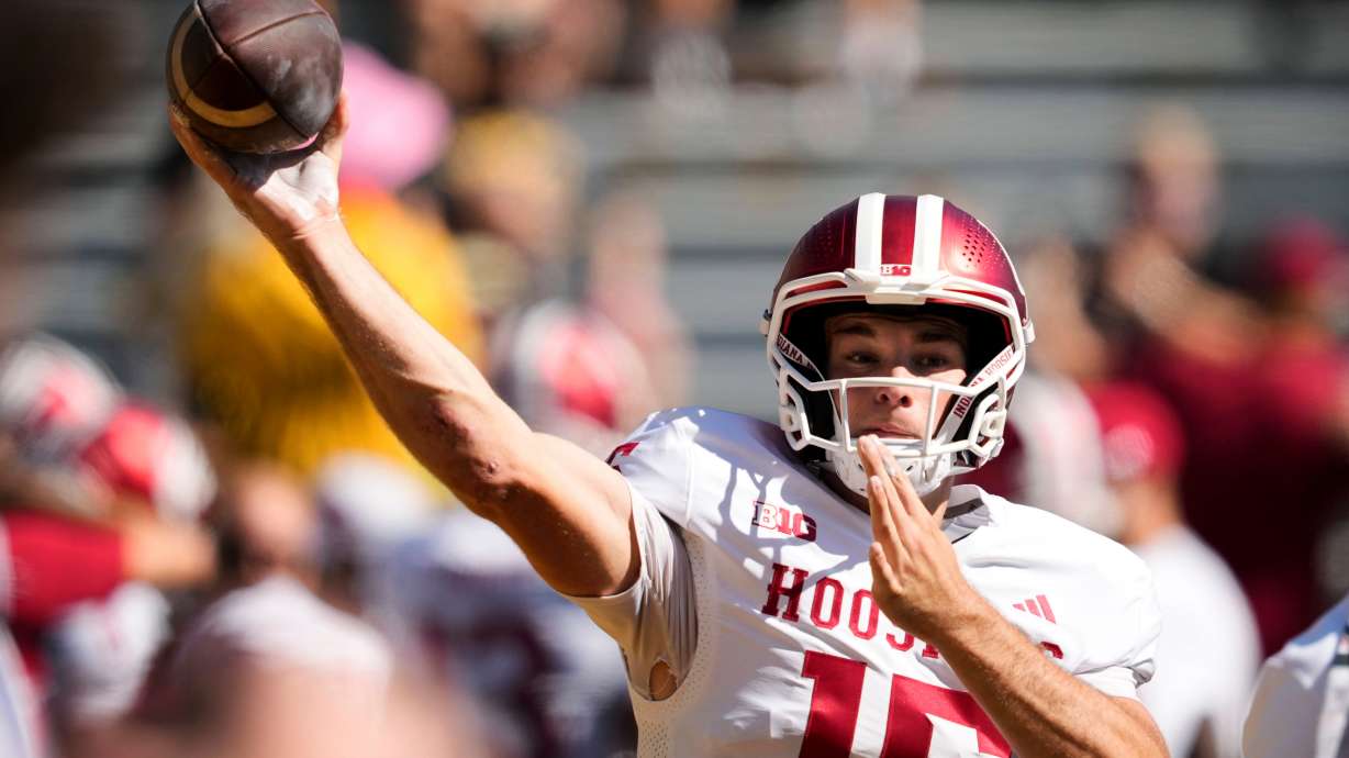 FILE - Indiana quarterback Fernando Mendoza warms up before an NCAA college football game against Iowa, Saturday, Sept. 27, 2025, in Iowa City, Iowa.