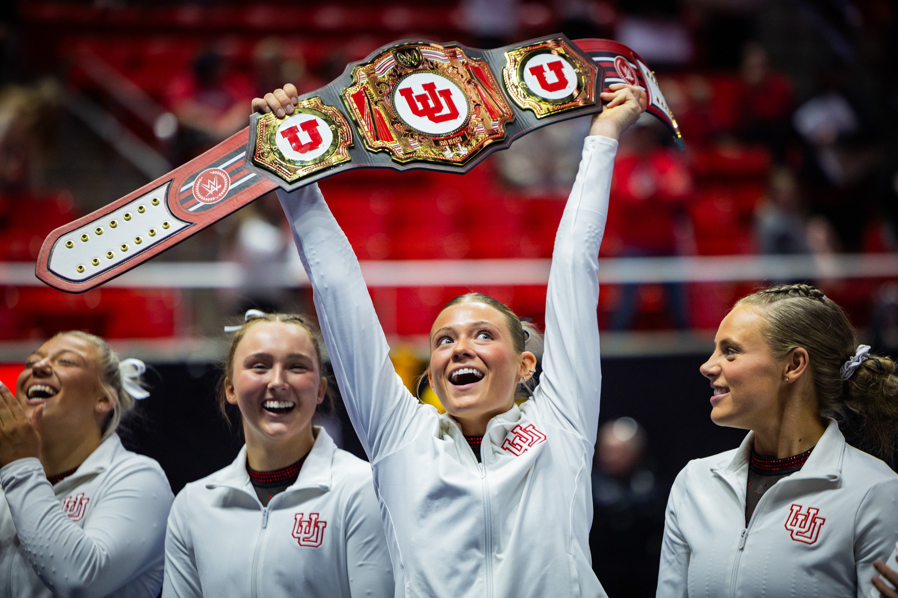 Utah Utes Avery Neff, center, celebrates after winning the fan poll after the Red Rocks Preview at the Jon M. Huntsman Center  in Salt Lake City on Friday, Dec. 12, 2025.