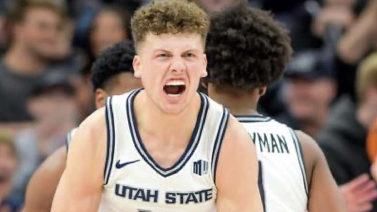 Utah State guard Mason Falslev (12) celebrates after making a basket against Illinois State Saturday afternoon at the Delta Center in Salt Lake City. The Aggies beat the Redbirds, 83-78.