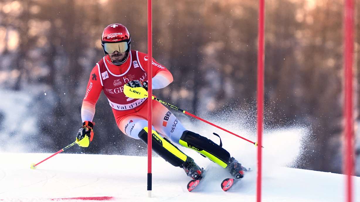 Switzerland's Loic Meillard speeds down the course during an alpine ski, men's World Cup slalom event, in Val d'Isere, France, Sunday Dec. 14, 2025.