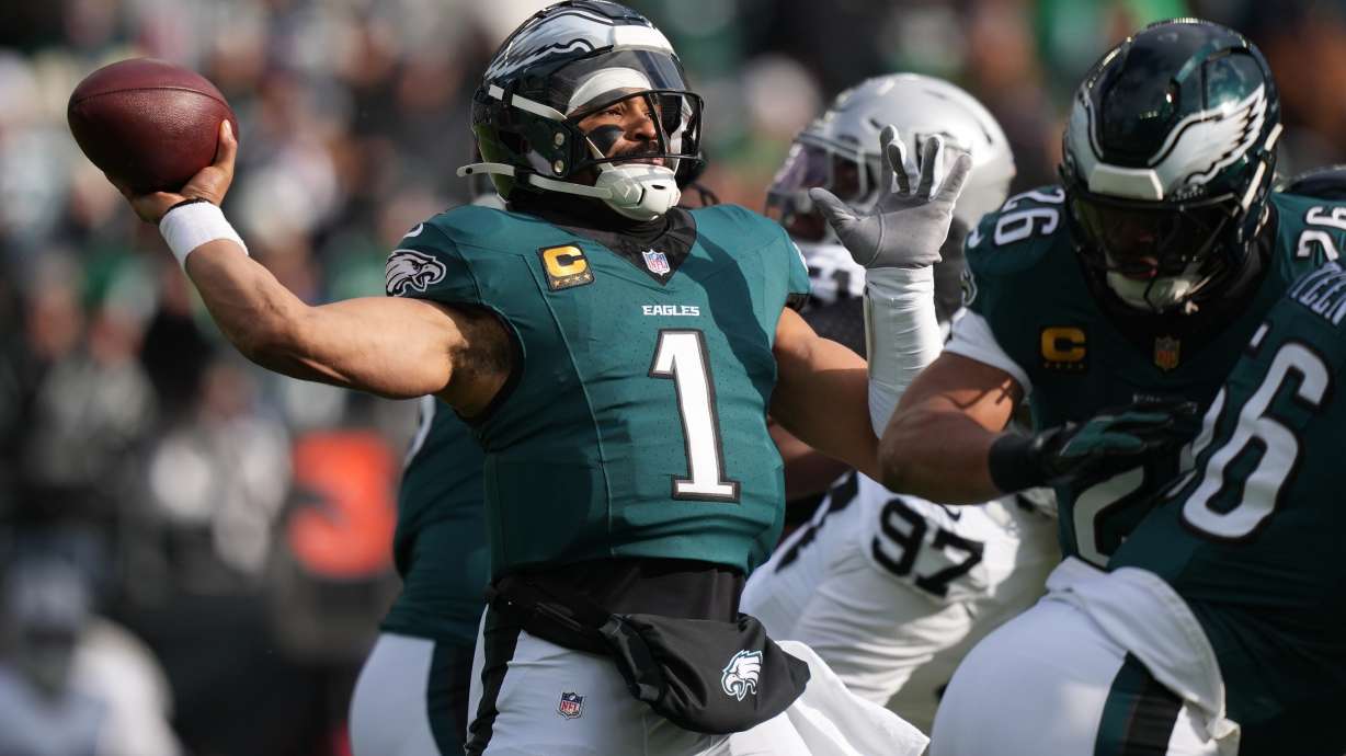 Philadelphia Eagles quarterback Jalen Hurts (1) throws during the first half of an NFL football game against the Las Vegas Raiders on Sunday, Dec. 14, 2025, in Philadelphia.