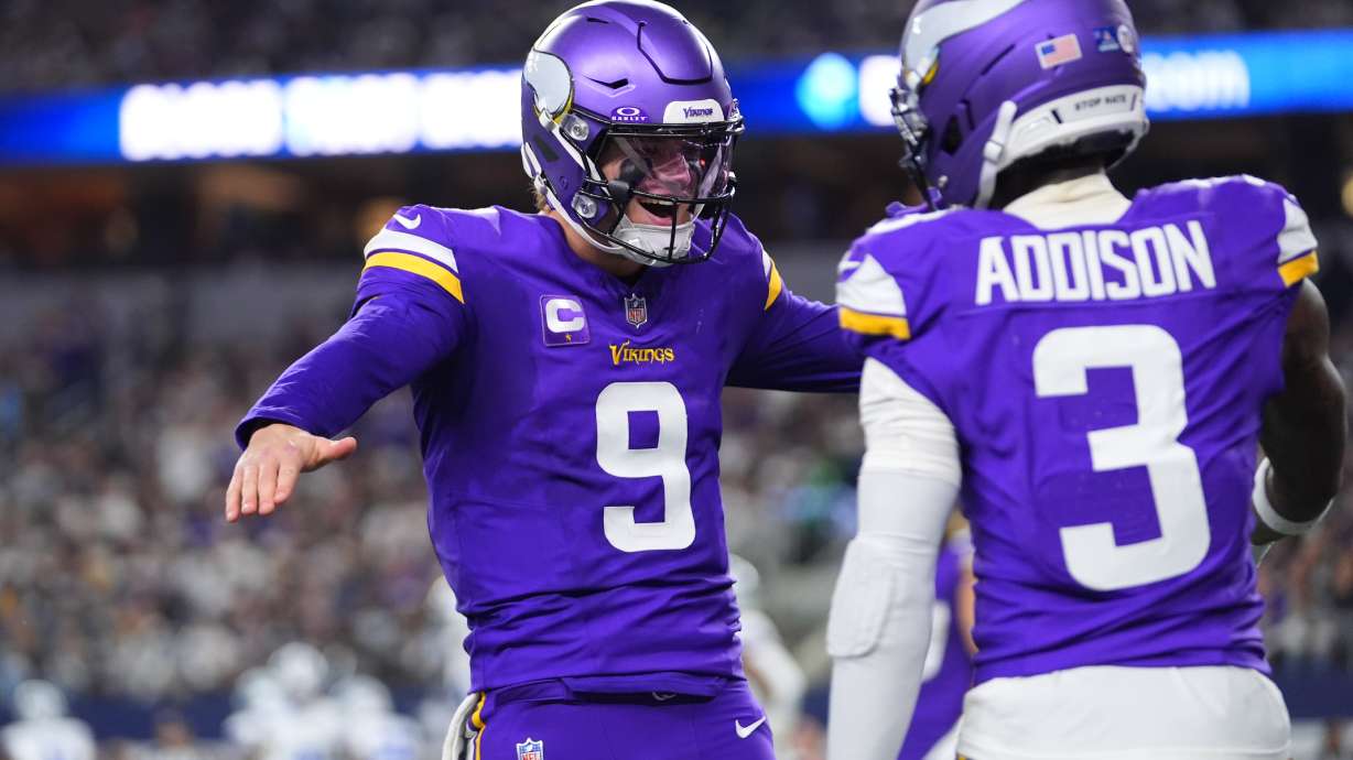 Minnesota Vikings quarterback J.J. McCarthy (9) and wide receiver Jordan Addison celebrate after a touchdown by wide receiver Jalen Nailor during the second half of an NFL football game against the Dallas Cowboys Sunday, Dec. 14, 2025, in Arlington, Texas.