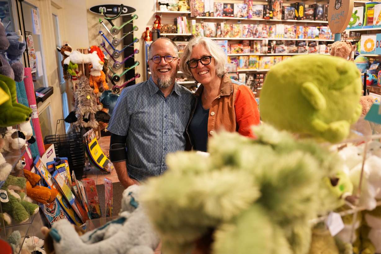 Co-owners Dean Smith, left, and Joanne Farrugia pose for a photograph in JaZams, one of their toy stores, June 27, in Princeton, N.J.