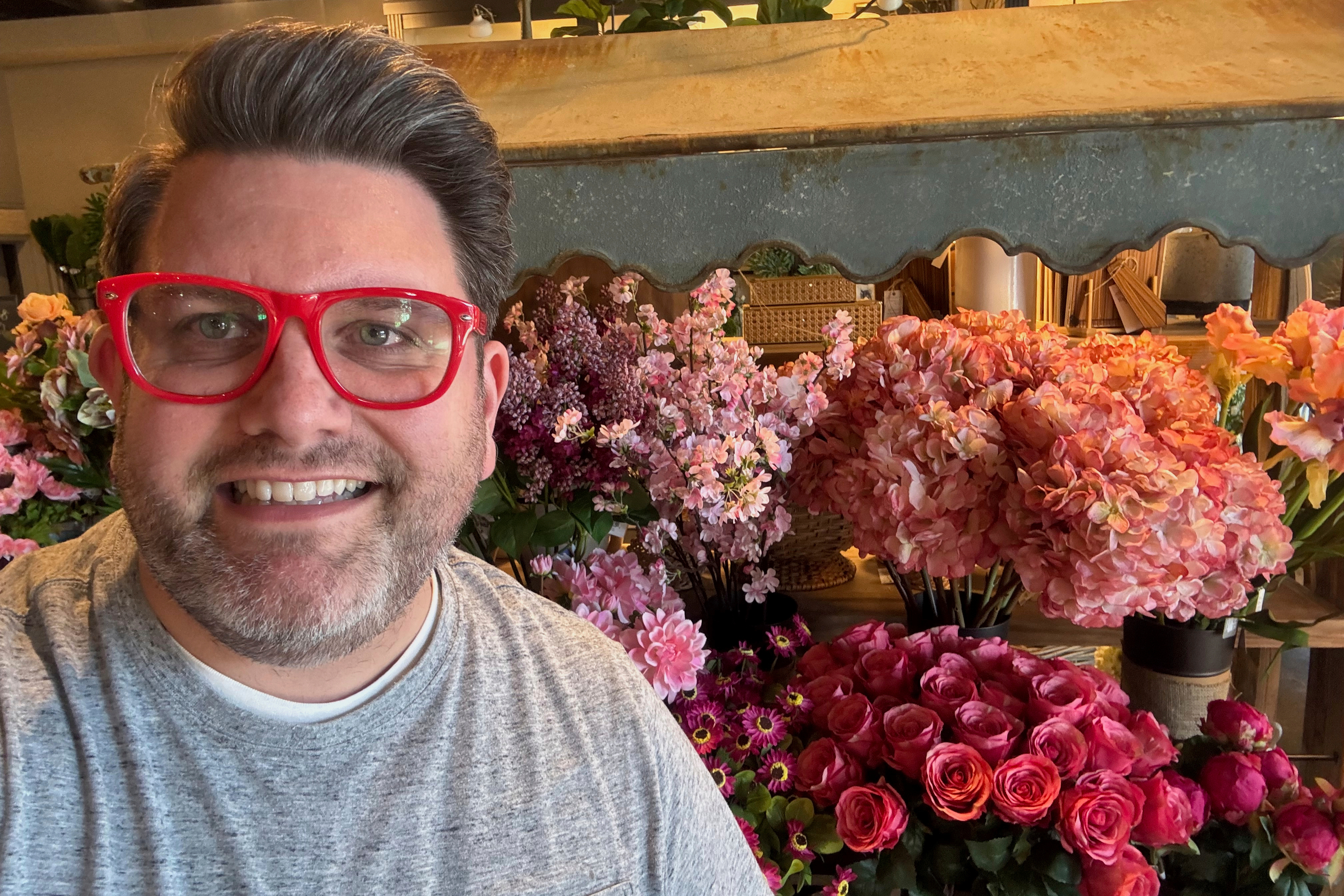 This undated photo provided by Jeremy Rice shows Rice at House, a home-décor shop that specializes in artificial flower arrangements for the home, in Lexington, Ky.