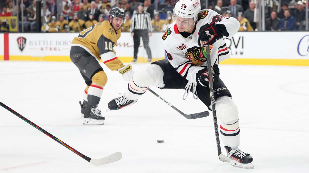 Chicago Blackhawks center Connor Bedard (98) passes the puck against the Vegas Golden Knights during the first period of an NHL hockey game Tuesday, Dec. 2, 2025, in Las Vegas.