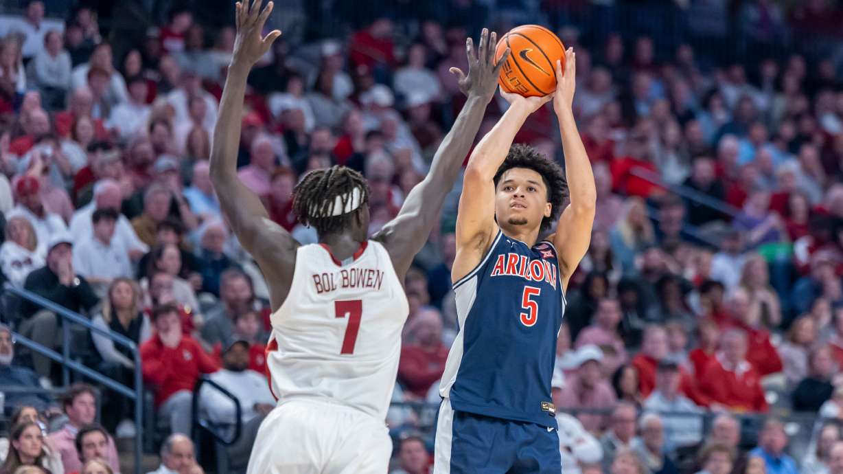 Alabama forward Amari Allen (5) shoots and hits a three-point shot over the defense of Alabama forward Taylor Bol Bowen (7) during the second half of an NCAA college basketball game, Saturday, Dec. 13, 2025, in Birmingham, Ala.