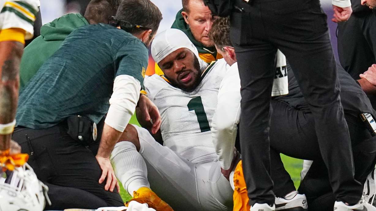 Green Bay Packers' Micah Parsons reacts after an injury during the second half of an NFL football game against the Denver Broncos Sunday, Dec. 14, 2025, in Denver.