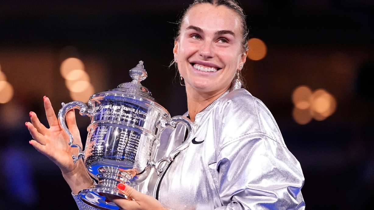 FILE - Aryna Sabalenka, of Belarus, holds her trophy aftyer defeating Amanda Anisimova, of the United States, after the women's finals of the U.S. Open tennis championships, Saturday, Sept. 6, 2025, in New York.