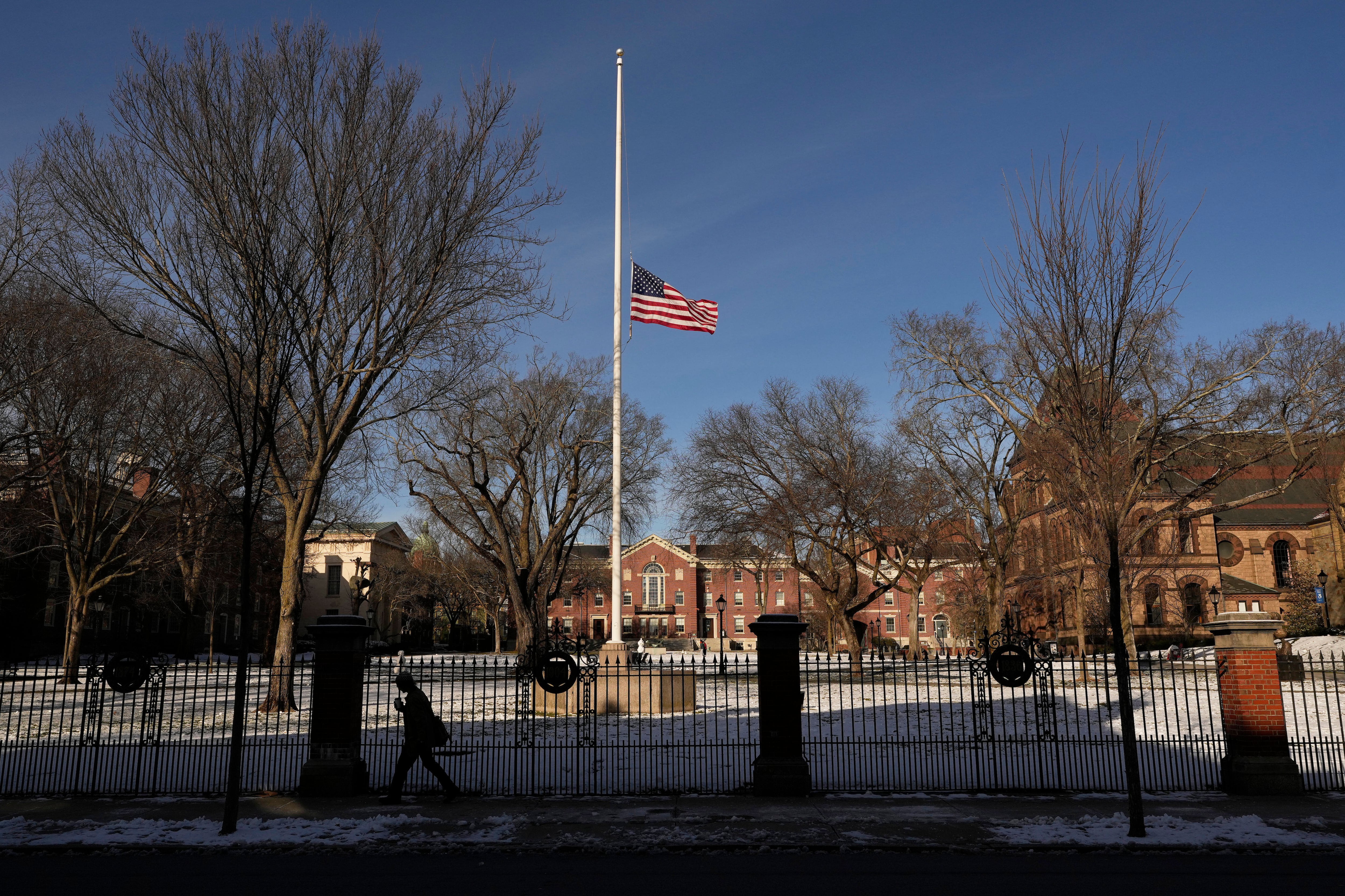 The United States flag flies at half-staff as a sign of mourning for the victim's of Saturday's shooting, on the campus of Brown University, Monday, in Providence, R.I.