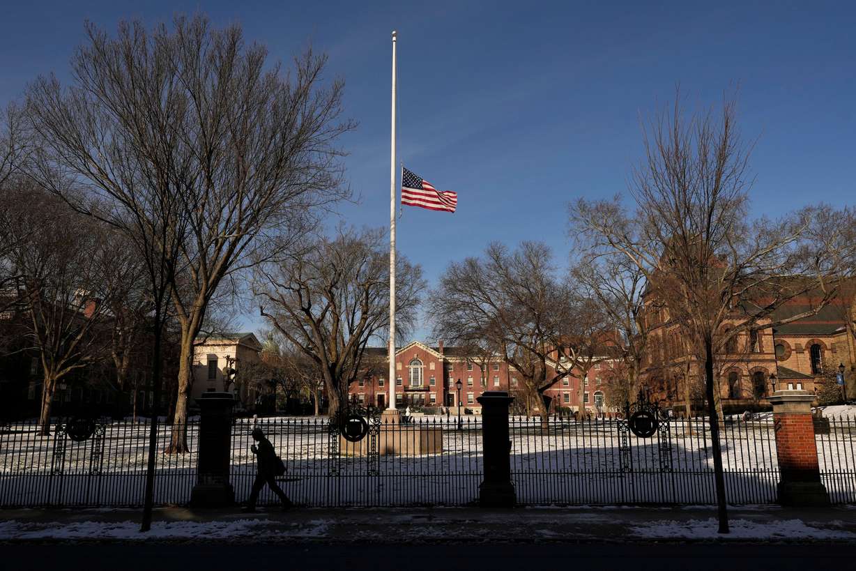 The United States flag flies at half-staff as a sign of mourning for the victim's of Saturday's shooting, on the campus of Brown University, Monday, in Providence, R.I.
