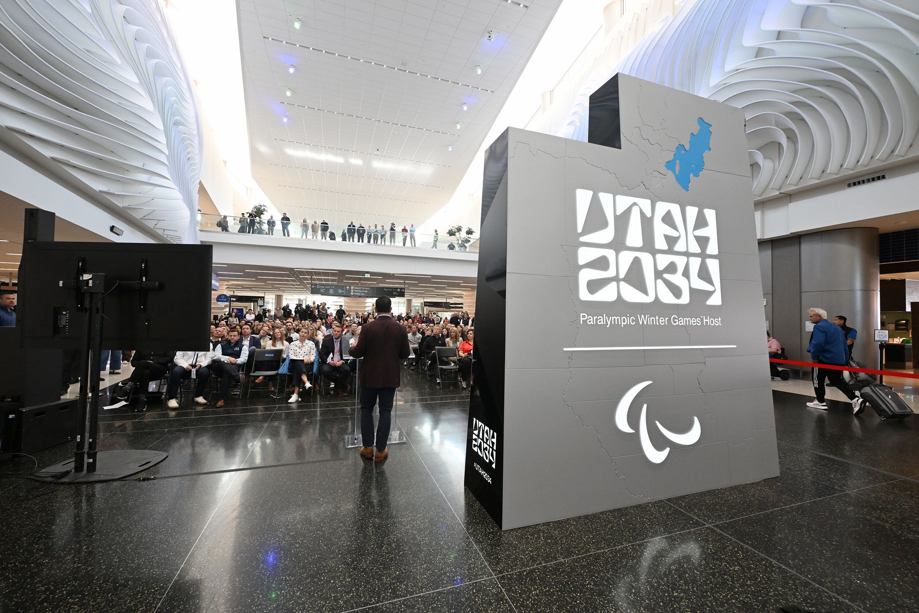 Brad Wilson talks as members of the organizing committee, state and local leaders, and former athletes gather to celebrate 3,000 days until the 2034 Winter Olympics during a ceremony at the Salt Lake City International Airport on Nov. 24.