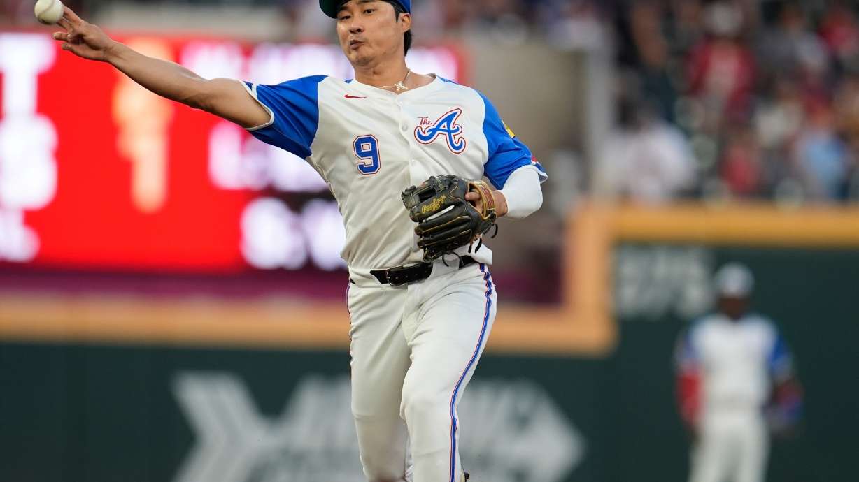 FILE - Atlanta Braves shortstop Ha-Seong Kim fields a ball hit by Pittsburgh Pirates' Oneil Cruz in the first half of a baseball game Sept. 27, 2025, in Atlanta.