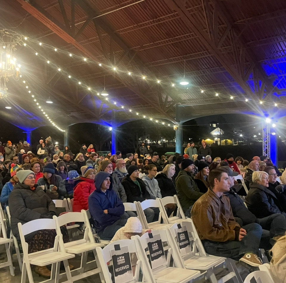 The crowd watches before the menorah lighting at a Hanukkah celebration at Electric Park in Lehi on Monday.