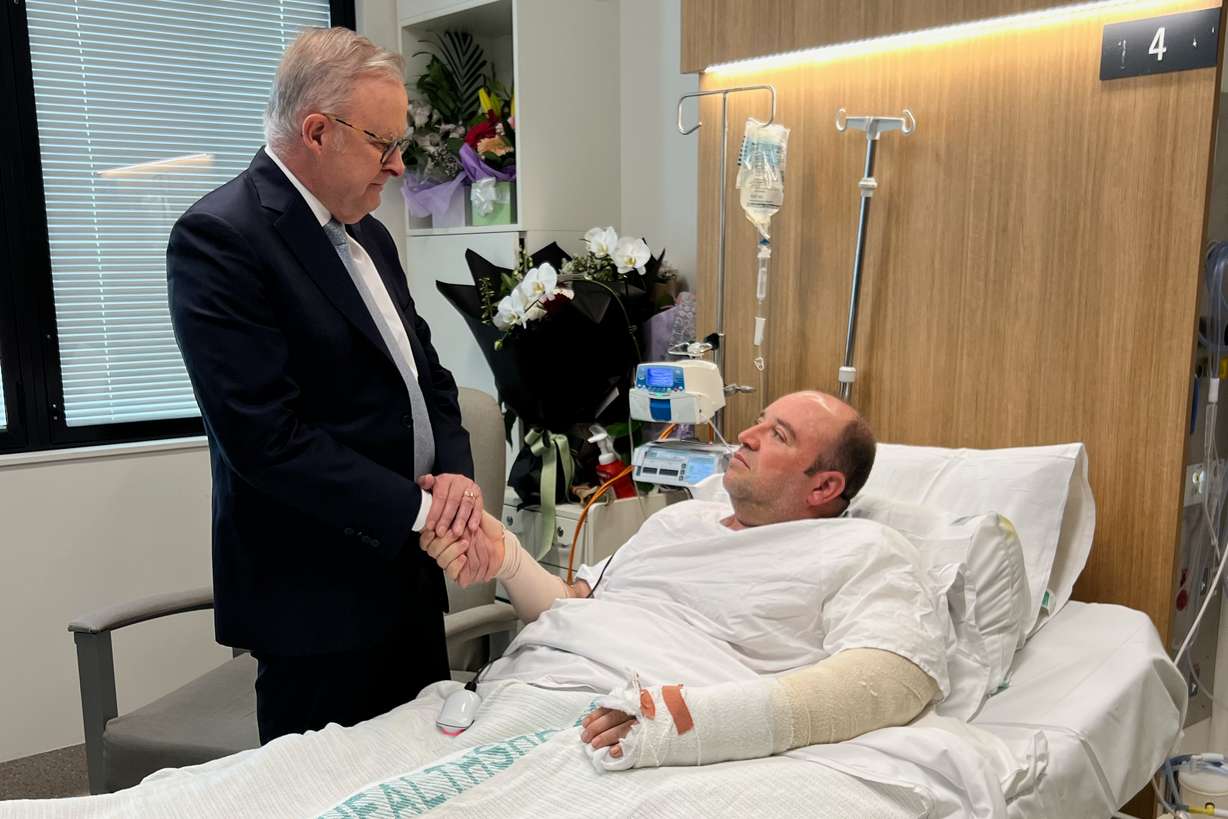 Australian Prime Minister Anthony Albanese meets Ahmed al Ahmed at St George Hospital in Sydney, Tuesday. Al Ahmed was due to undergo surgery Wednesday after he was able to disarm one of the gunmen at the Bondi Beach attack.