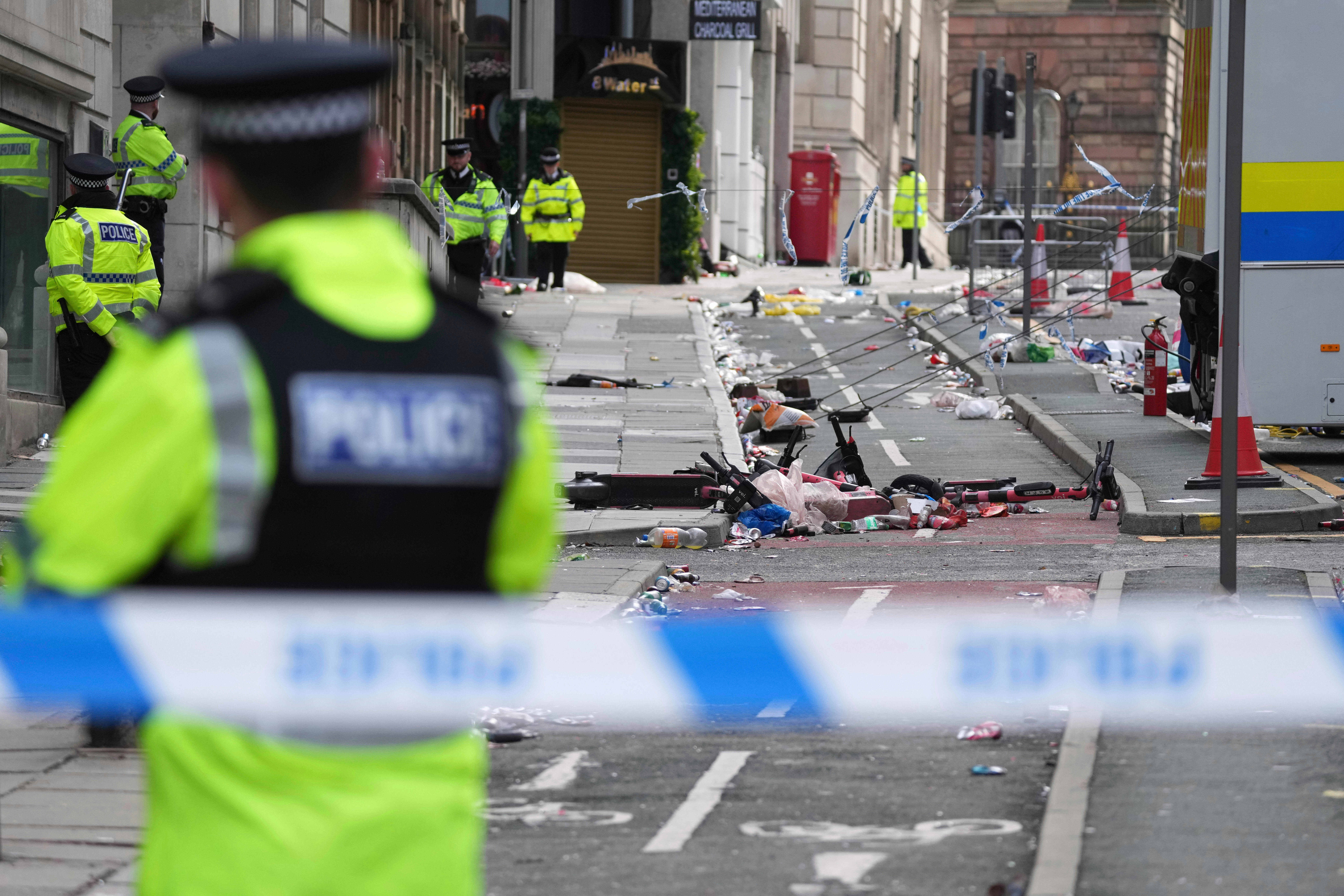 FILE - Police guards the site where a 53-year-old British man plowed a minivan into a crowd of Liverpool soccer fans who were celebrating the city's Premier League championship Monday, injuring more than 45 people in Liverpool, England, Tuesday, May 27, 2025.