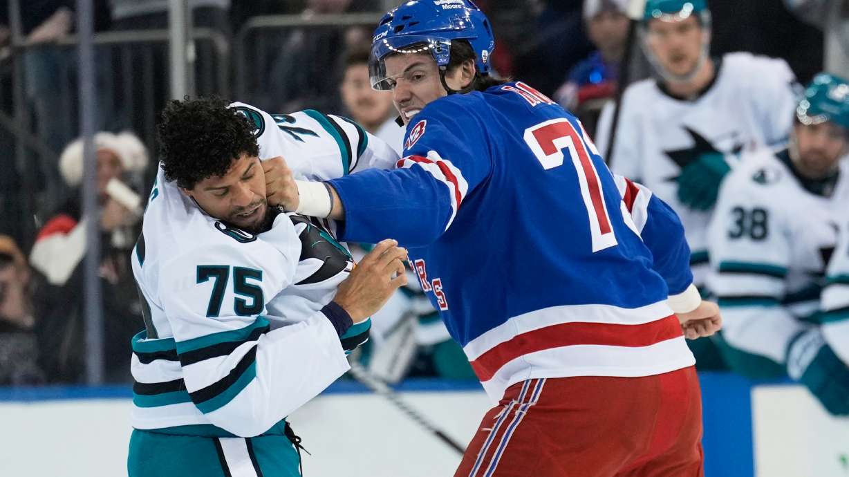 FILE - New York Rangers' Matt Rempe, right, fights with San Jose Sharks' Ryan Reaves (75) during the first period of an NHL hockey game in New York, Oct. 23, 2025.