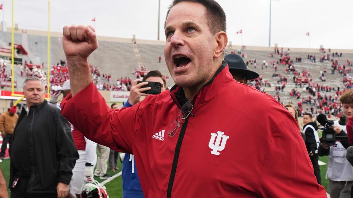 FILE - Indiana head coach Curt Cignetti shouts to the fans as he leaves the field following an NCAA college football game against UCLA, Saturday, Oct. 25, 2025, in Bloomington, Ind.